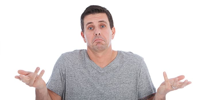 Ignorant man giving a dismissive shrug